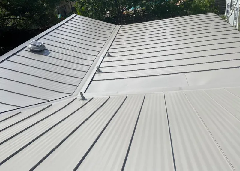 Solar attic fan installed on a metal roof for Roof Ventilation in Tinley Park